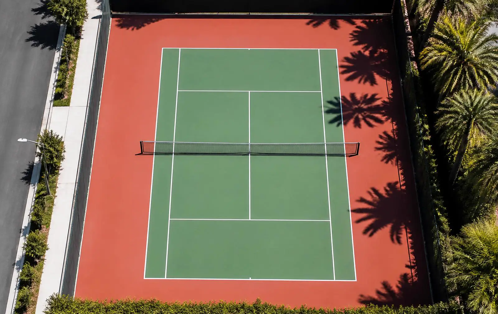 Overhead view of an outdoor tennis court of the kind used for lessons around Arcadia